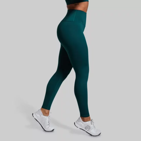 tights, Synergy Legging, Kvinne med mørkegrønn treningstights. Tightsen er høy i livet.